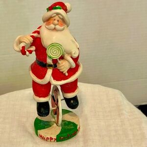 Vintage Christmas Santa riding a Unicycle!
Good pre-owned condition!